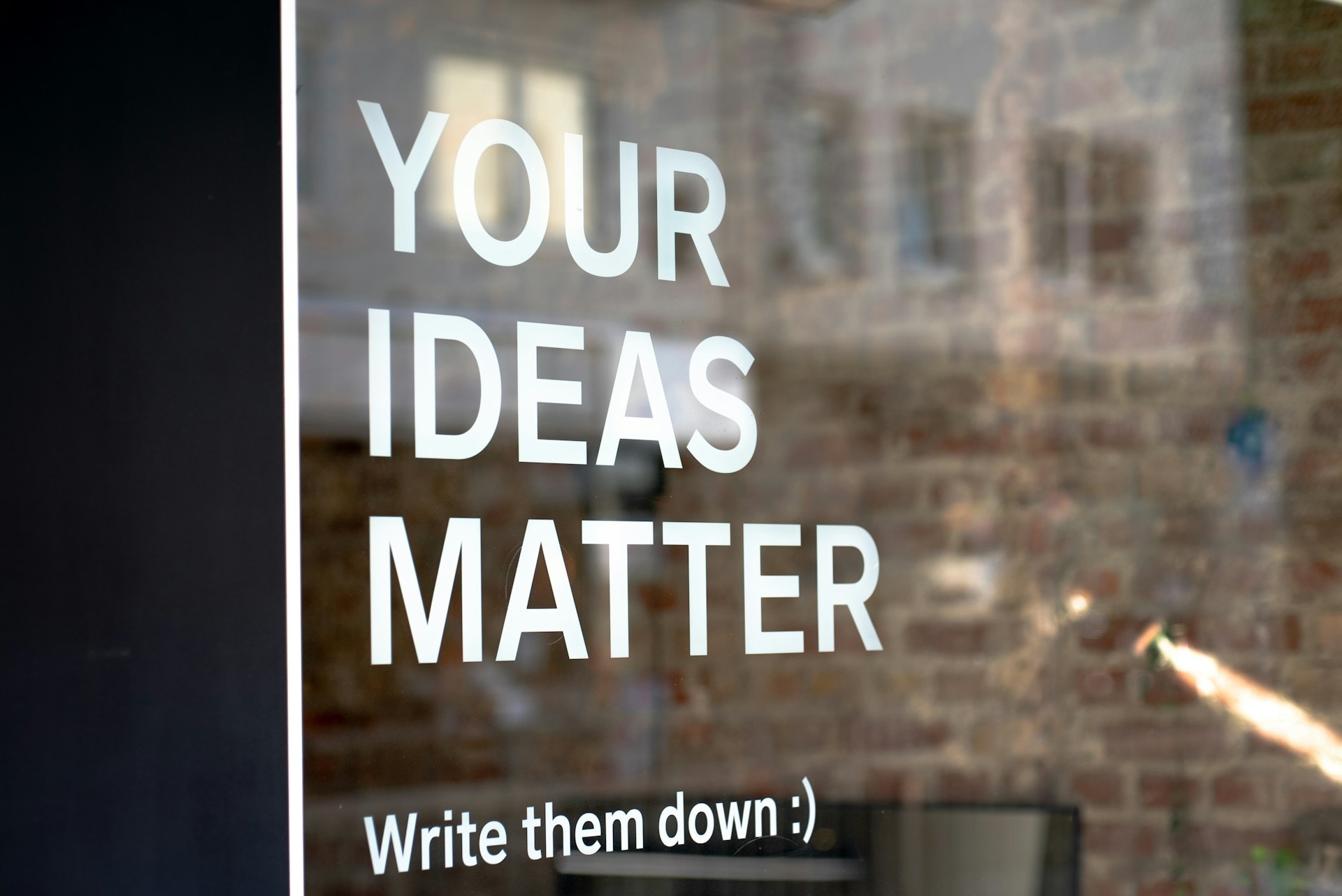 A stock image of a window and text on it that says "Your Ideas Mater. Write them down :)" Make sure to read the submission guidelines before you submit personal essays and avoid using AI tools